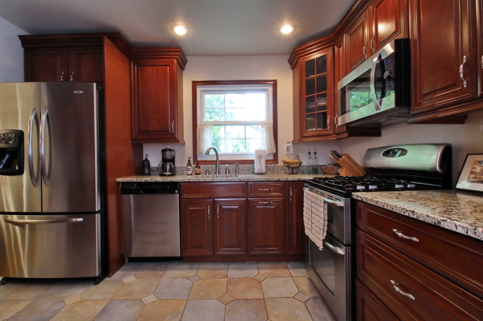 Stunning Modern Kitchen - Cherry KraftMaid Cabinets, Granite and Stainless Steel Appliances